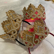 Load image into Gallery viewer, A beautiful Gold and pearl crown. In gold, flat ivory pearls. perched on top of a flexible Alice band.