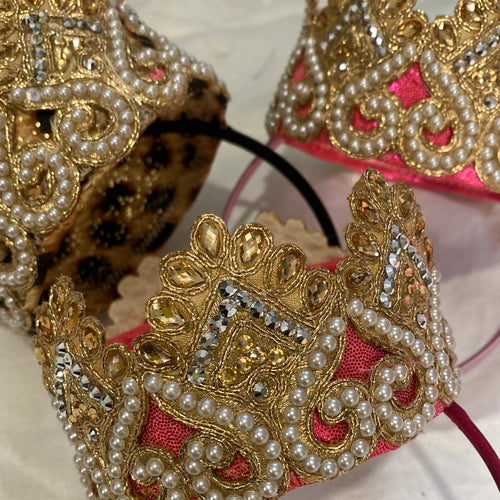 A beautiful Gold and pearl crown.  In gold, flat ivory pearls. perched on top of a flexible Alice band.