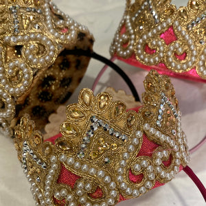 A beautiful Gold and pearl crown.  In gold, flat ivory pearls. perched on top of a flexible Alice band.