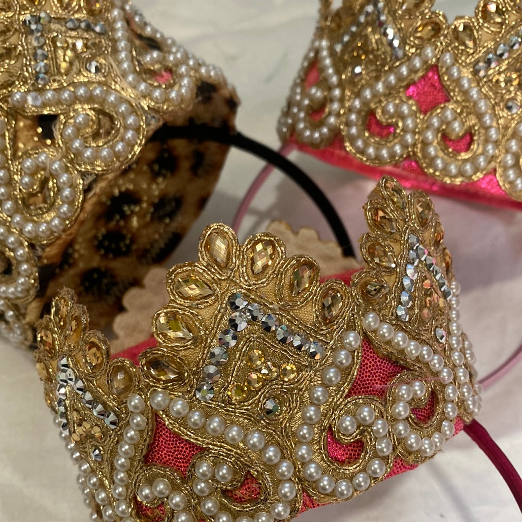 A beautiful Gold and pearl crown.  In gold, flat ivory pearls. perched on top of a flexible Alice band.